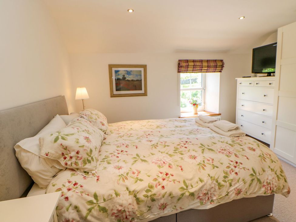 A bedroom with a bed and furniture at Wayside Farm in Richmond