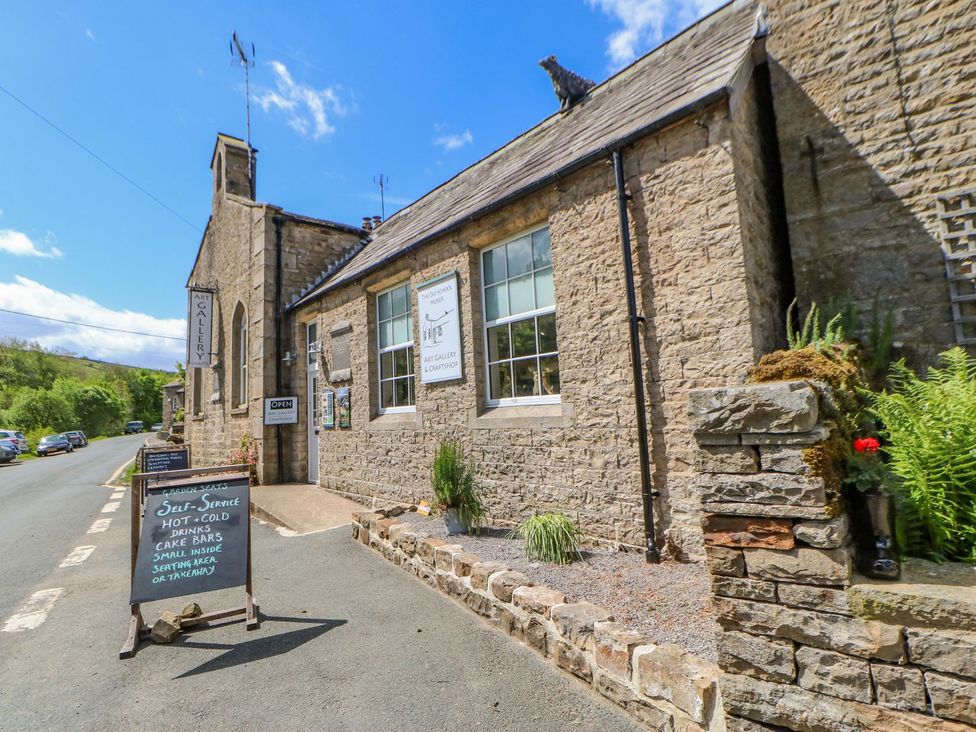 A building with an art gallery sign and a self-service sign at Wayside Farm in Richmond