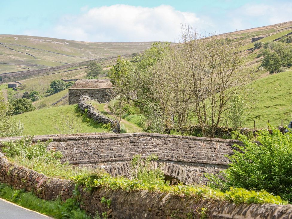 A landscape with hills and farm buildings at Wayside Farm in Richmond