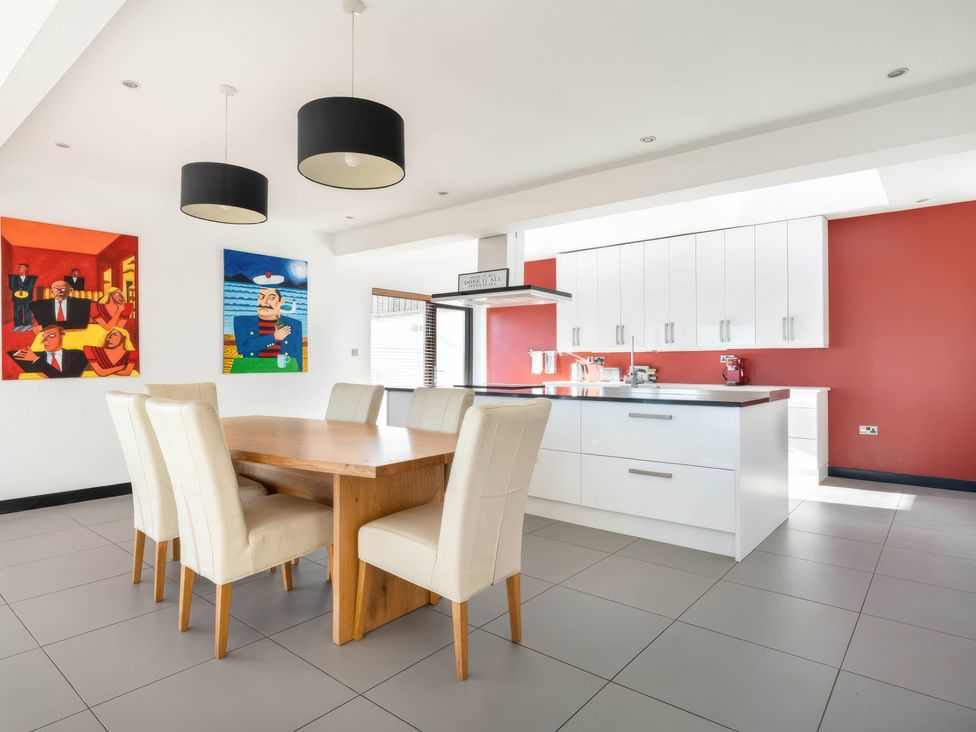 A kitchen with a dining table and chairs at Bellevue in 
