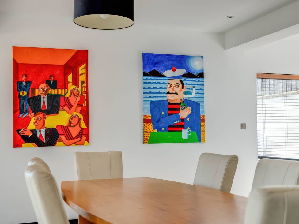 A dining room with art on the walls at Bellevue