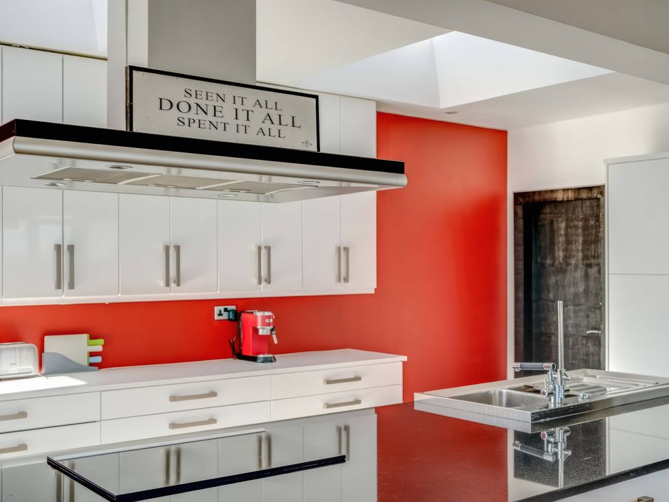 A modern kitchen with cabinets and an espresso machine at Bellevue