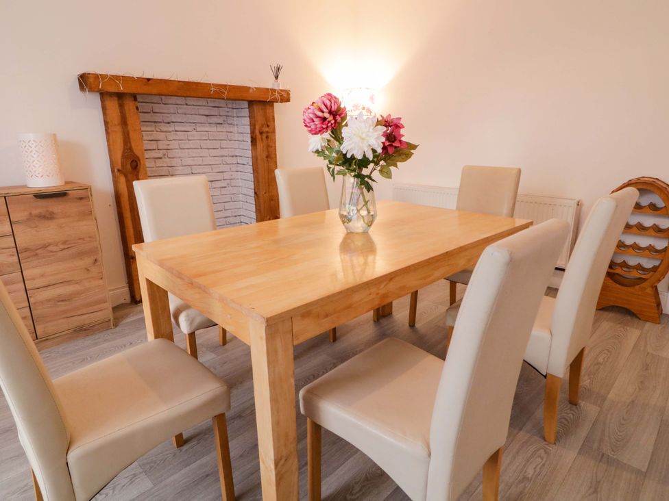 A dining room with a table and chairs at San Antonio in Dungloe, County Donegal