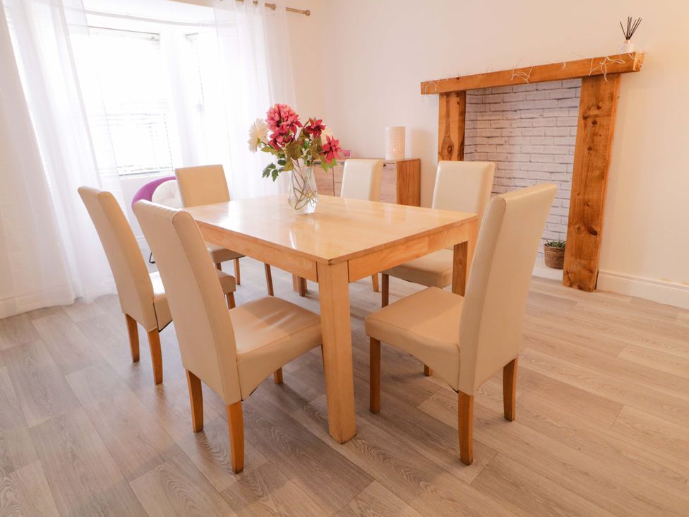 A dining room with a table and chairs at San Antonio Dungloe, County Donegal