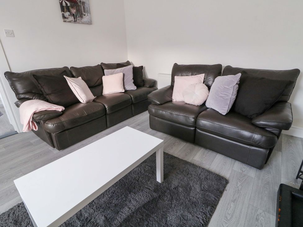 A living room with sofas and a coffee table at San Antonio in Dungloe, County Donegal