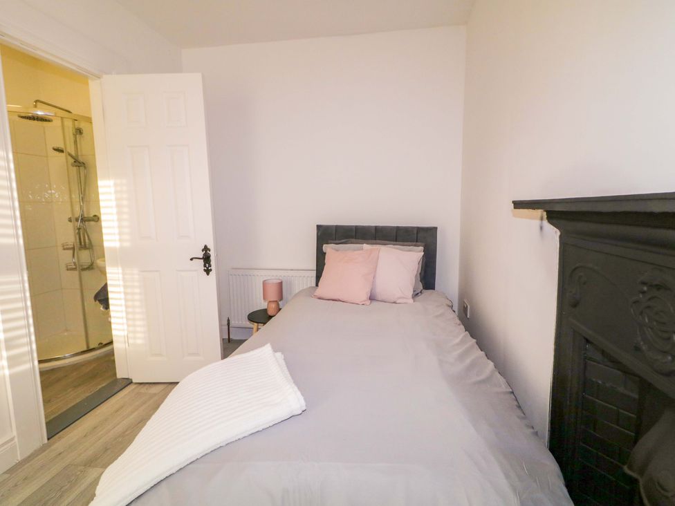 A bedroom with a bed and lamp at San Antonio, Dungloe, County Donegal