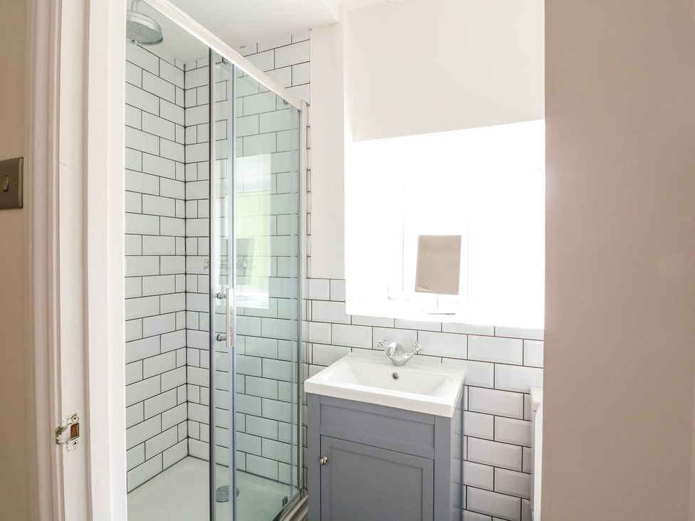 A bathroom with a shower and sink at The Old Bakery in Banbury