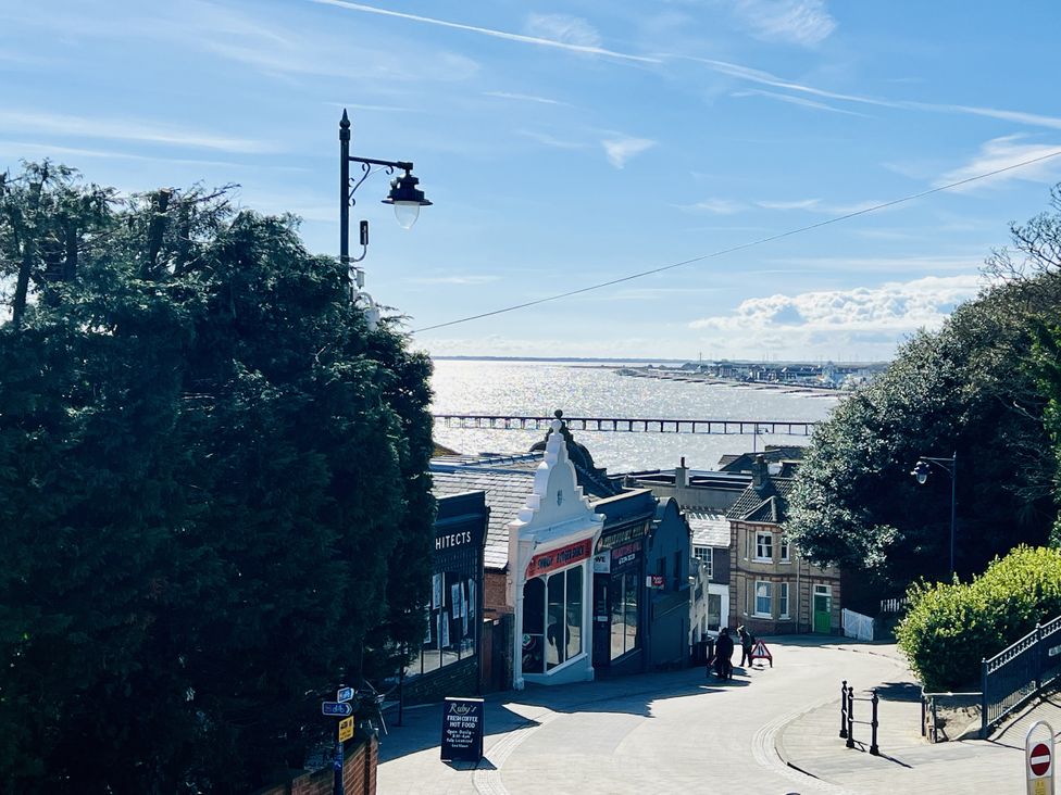 A view of the sea and pier with buildings on a street at 2A Hamilton Road Felixstowe