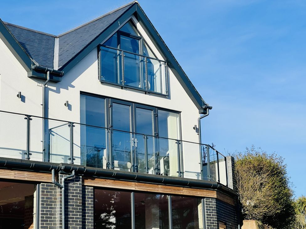A house exterior with balcony and glass doors at 2B Hamilton Road Felixstowe
