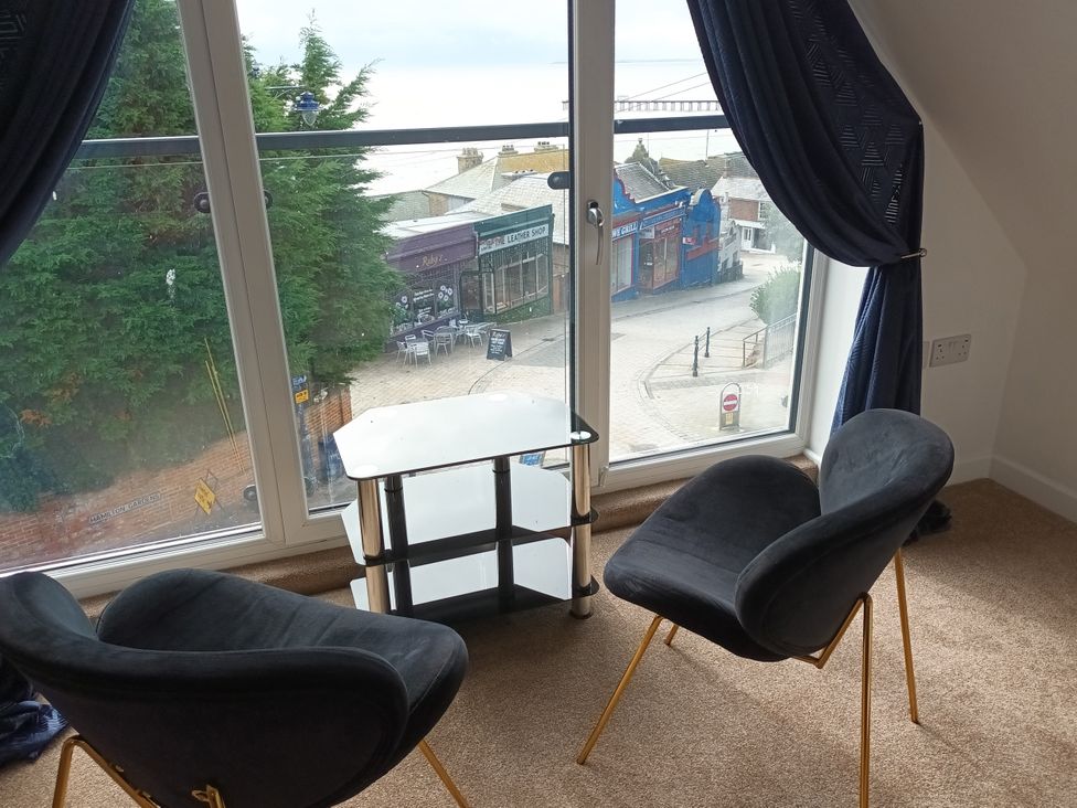 A living room with two chairs and a table at 2B Hamilton Road in Felixstowe