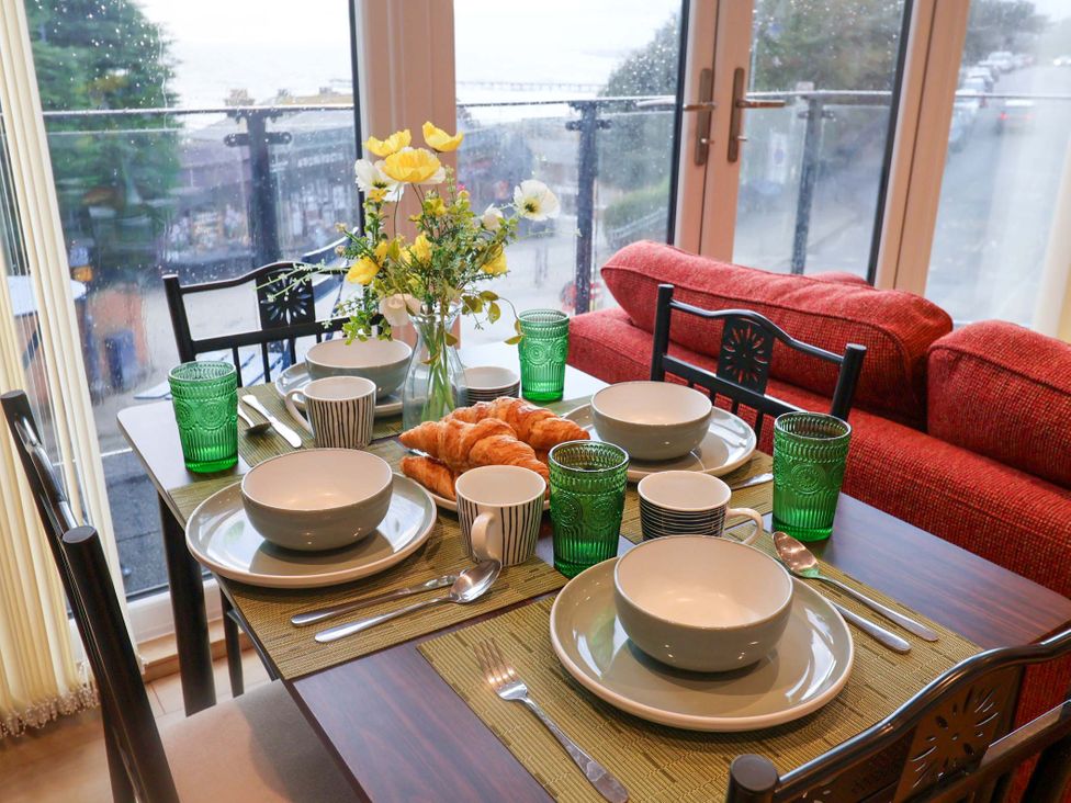 A dining room set with plates and croissants at 2B Hamilton Road, Felixstowe, Suffolk