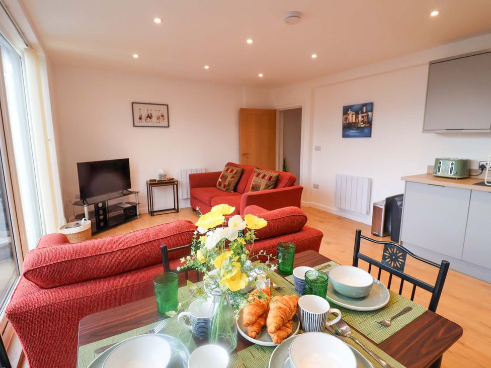 A living room with a dining table and sofa at 2B Hamilton Road, Felixstowe, Suffolk