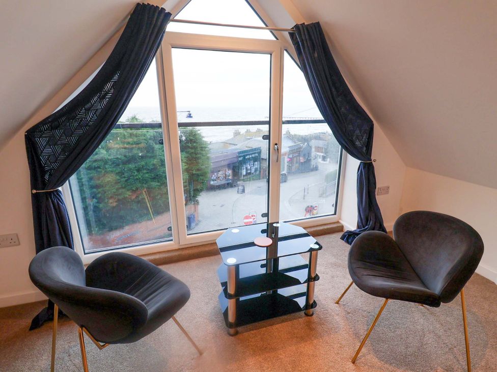 A sitting room with a view of the outside at 2B Hamilton Road in Felixstowe, Suffolk
