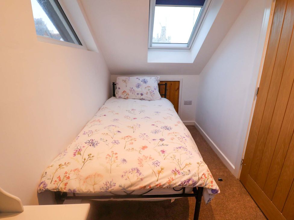 A bedroom with a bed and skylight at 2B Hamilton Road in Felixstowe, Suffolk