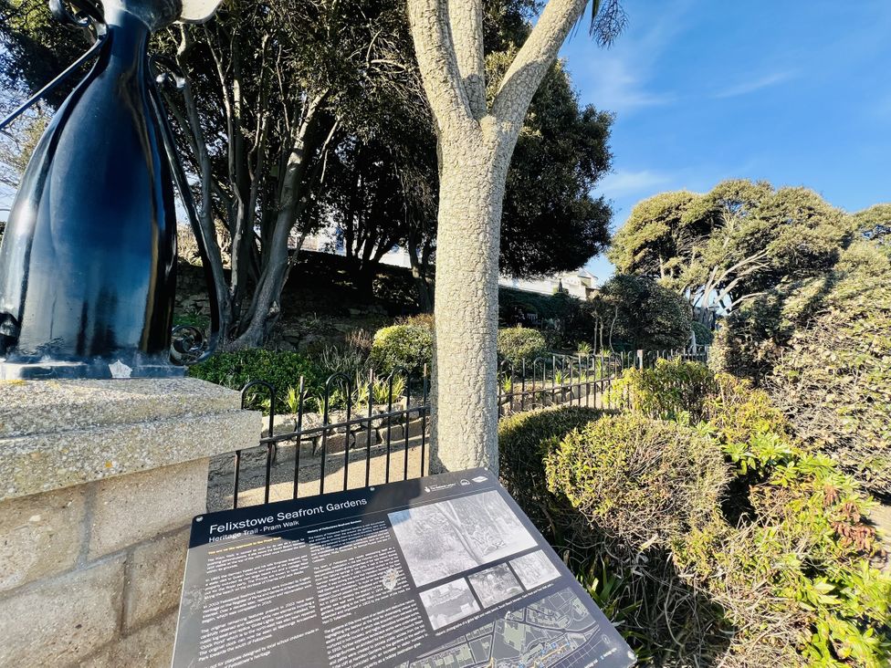 An information board and greenery at Felixstowe Seafront Gardens in Felixstowe