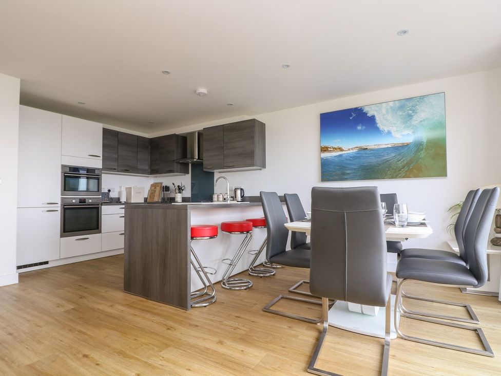 A kitchen with a dining area at Praa Waves in Penzance