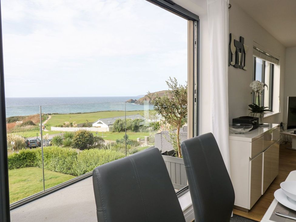 A living room with a view of the ocean at Praa Waves in Penzance