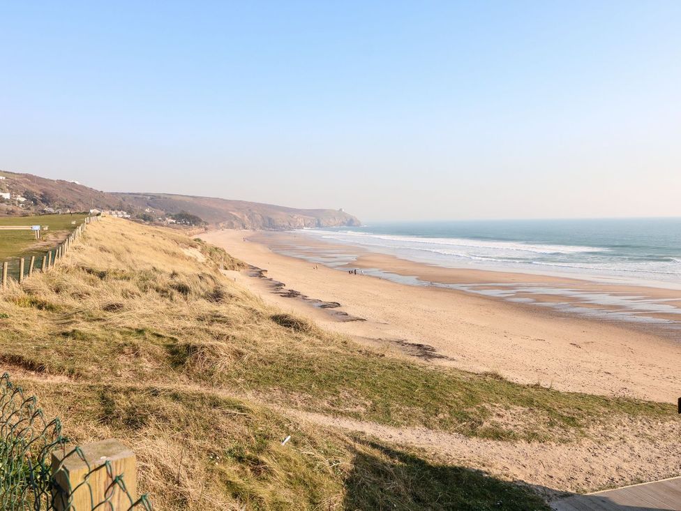 A beach with sand and ocean view at Praa Waves in Penzance