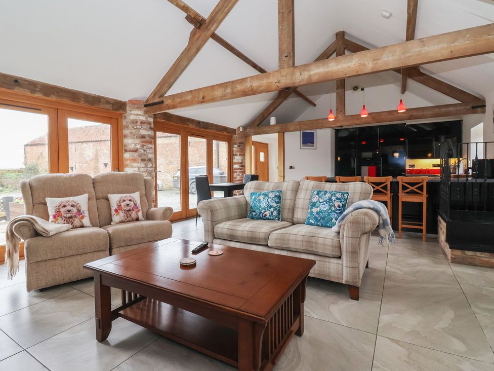A living room with a sofa and coffee table at Pillar Barn Driffield