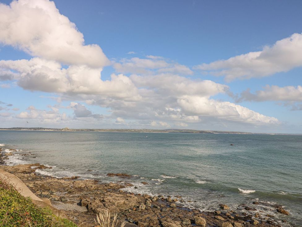 A view of the ocean and coastline at Harbour Lights in Penzance