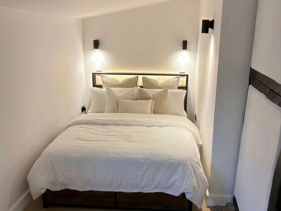 A bedroom with a bed and pillows at Lake Farm in Gloucester