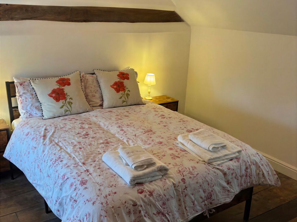 A bedroom with a bed and pillows at Lake Farm in Gloucester