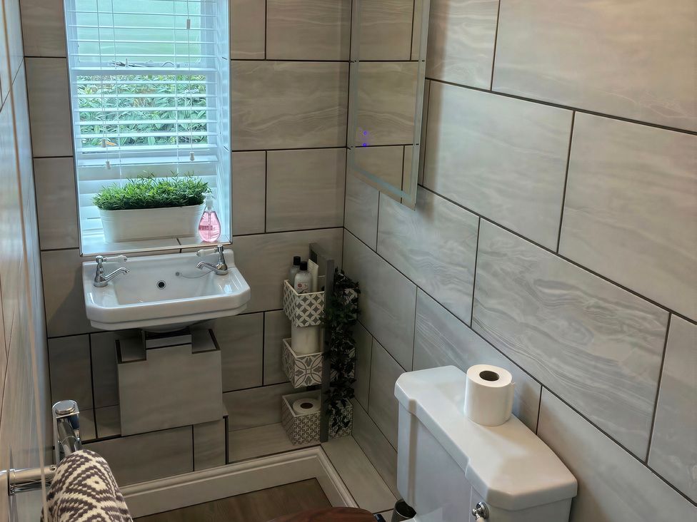 A bathroom with a sink and toilet at Lake Farm in Gloucester