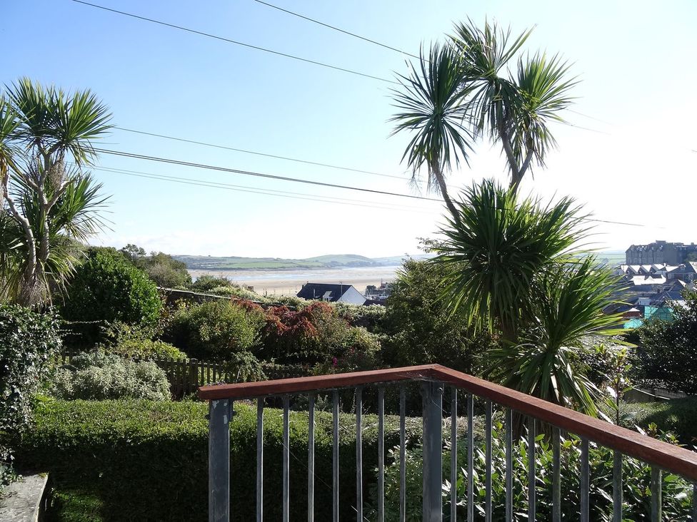 A garden with palm trees and a view at Mount Pleasant in Padstow