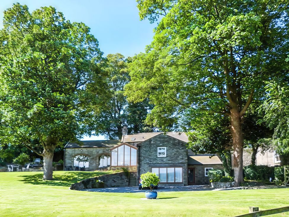 A house with surrounding trees and a lawn at Beningborough