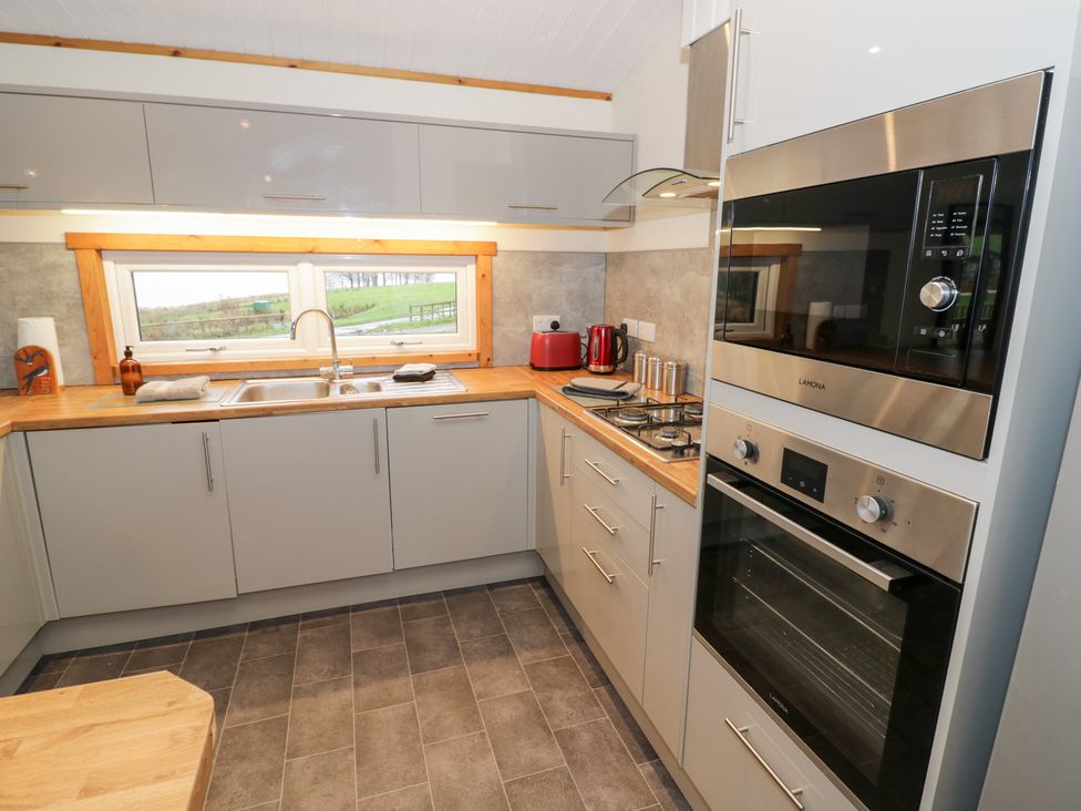 A kitchen with modern fixtures at Cedar Lodge in Rugeley