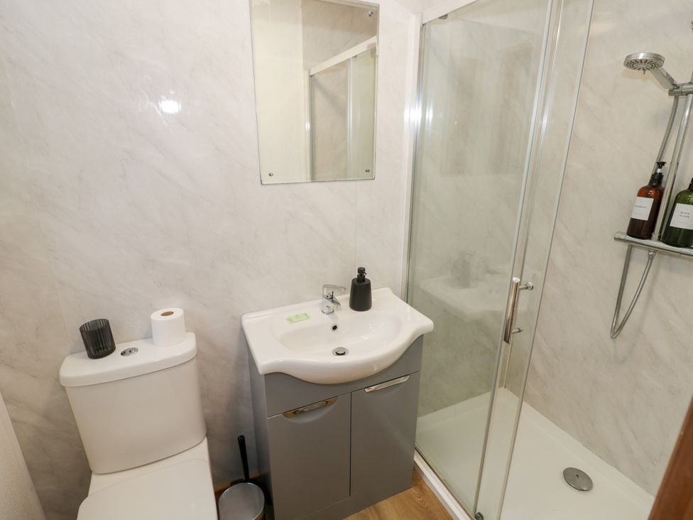A bathroom with shower and sink at Cedar Lodge in Rugeley