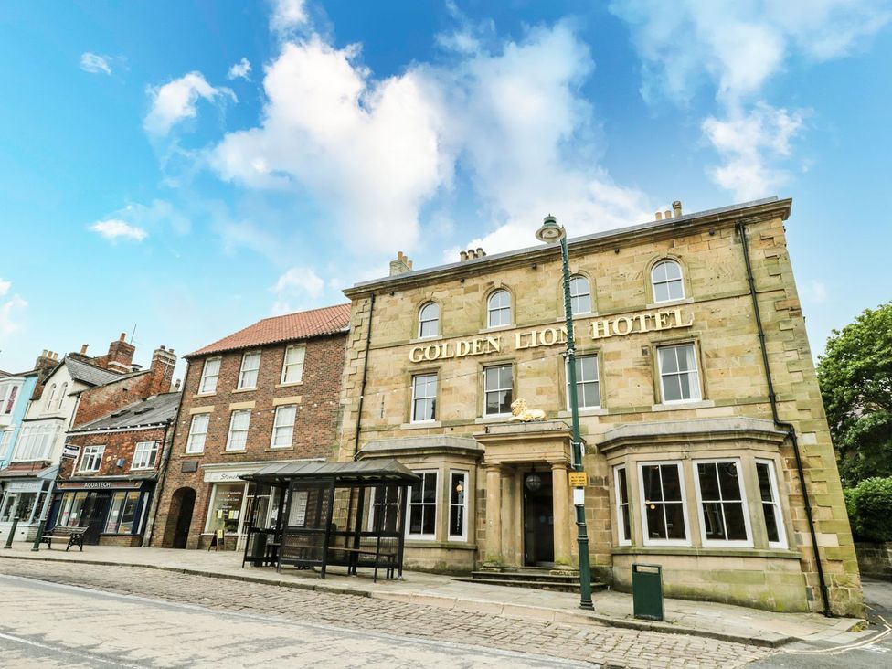 A hotel building with a sign on the front at The Kesi Residence in Loftus