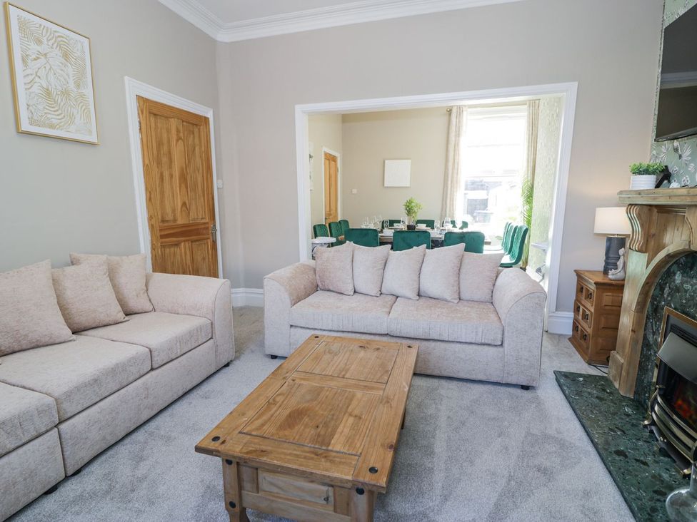 A living room with a sofa and coffee table seen at Canning Lodge in Colwyn Bay