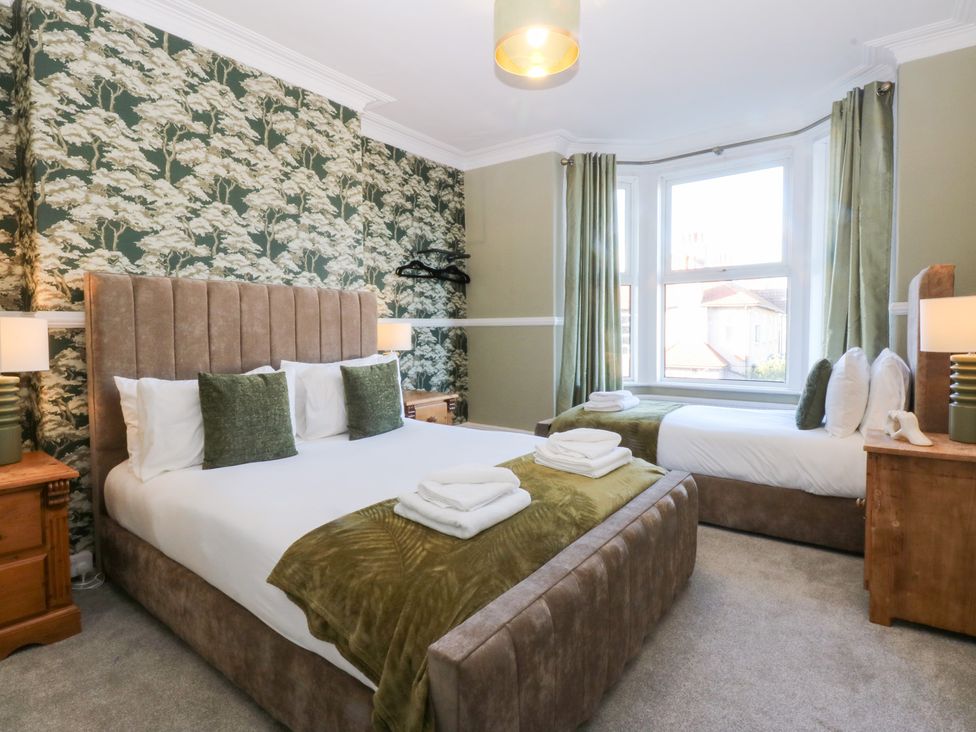 A bedroom with two beds at Canning Lodge in Colwyn Bay