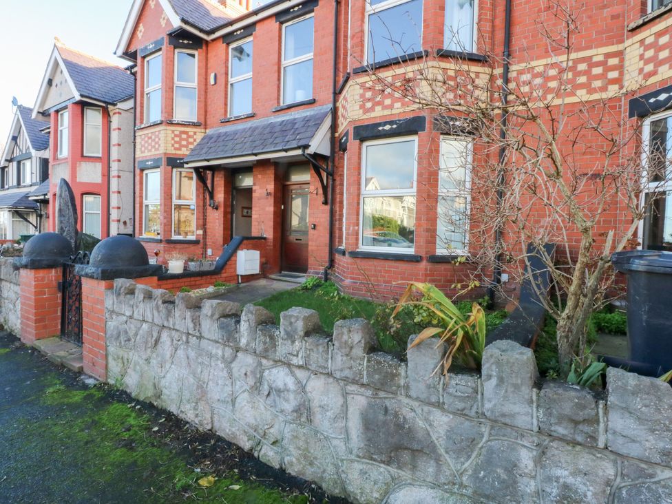 A house exterior with a garden area at Canning Lodge in Colwyn Bay