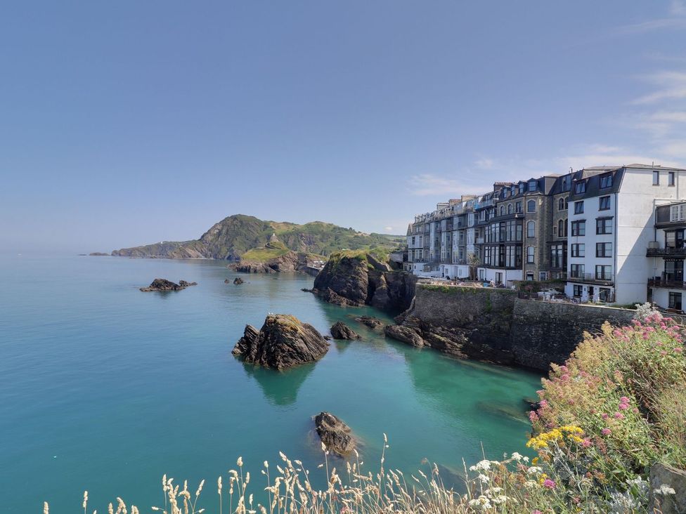 A coastal view with buildings near the sea at Val's Seaview Ilfracombe