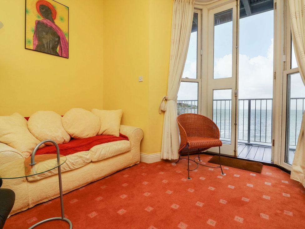 A living room with a sofa and coffee table at Val's Seaview in Ilfracombe