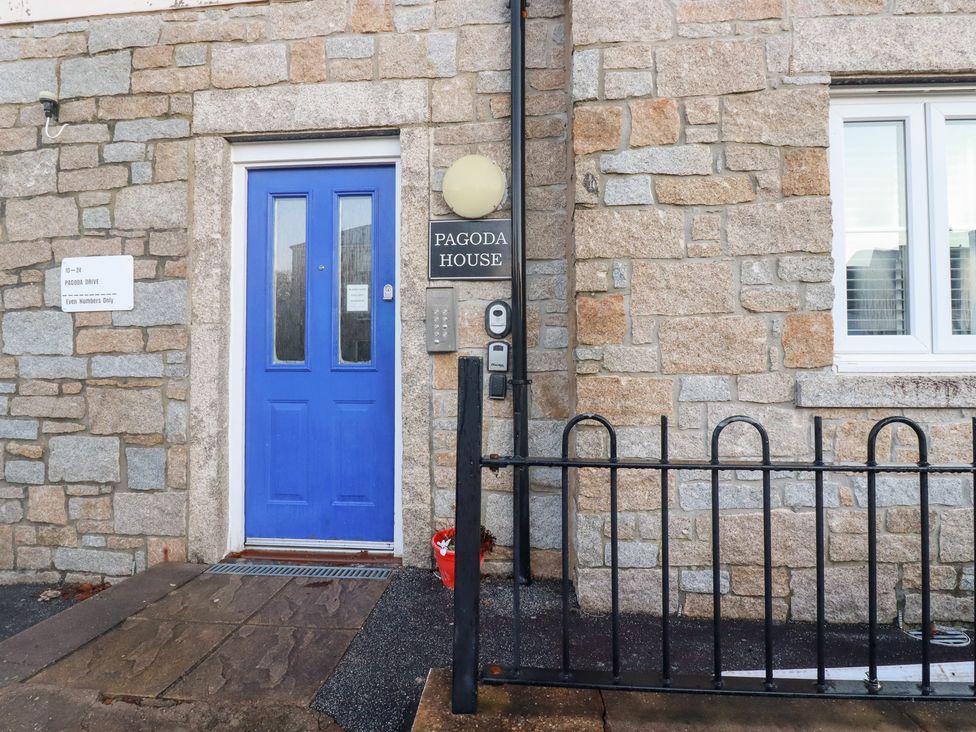 A blue door and sign at Pagoda House in St. Austell
