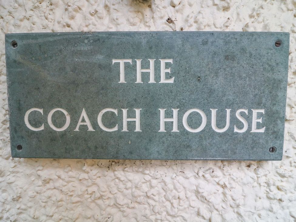 Name plaque displaying The Coach House in Carnforth