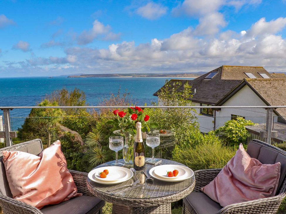 A table with champagne and strawberries on an outdoor terrace at 2 Remera in St. Ives