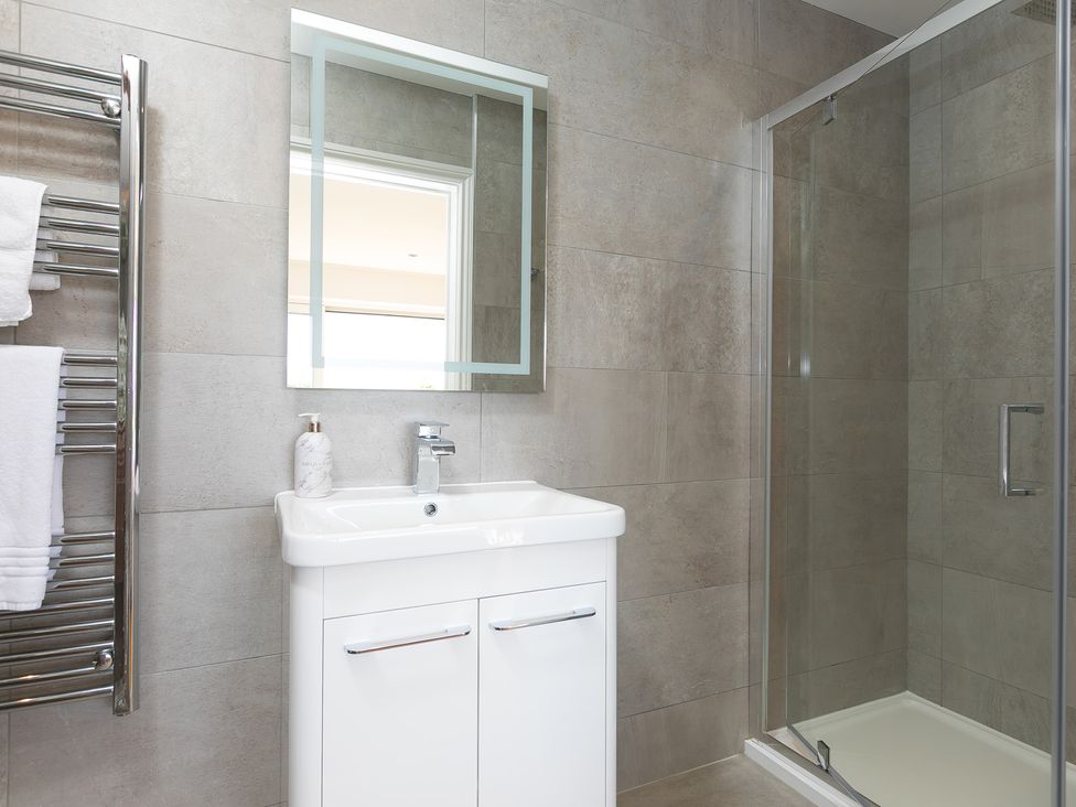 A bathroom with a shower and sink at 2 Remera St Ives