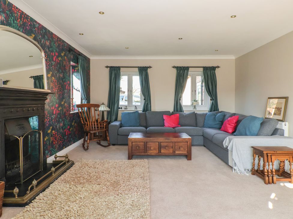 A living room with a sofa and fireplace at The Redwoods in 