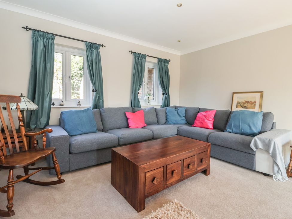 A living room with a sofa and coffee table at The Redwoods 