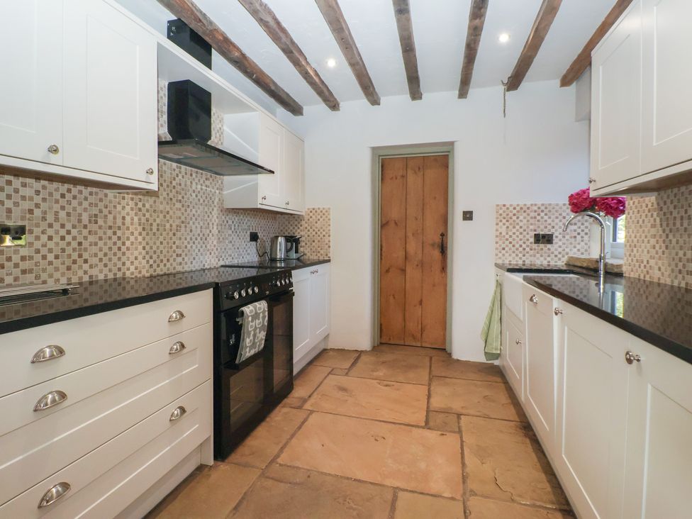 A kitchen with counters and appliances at The Redwoods in 