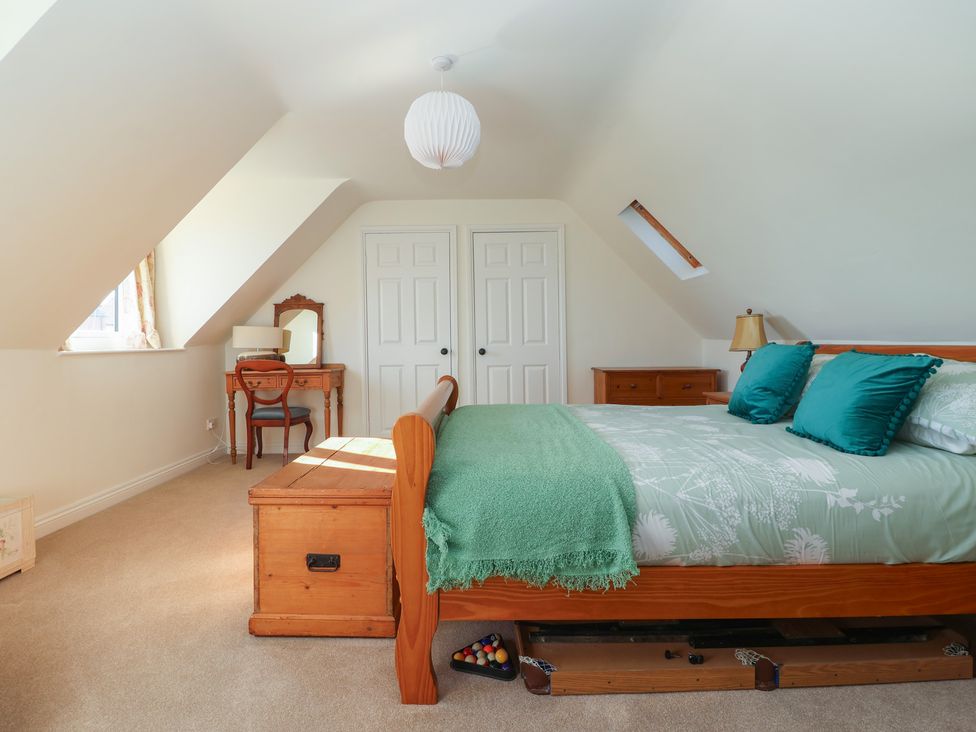 A bedroom with a bed and a mirror at The Redwoods in 
