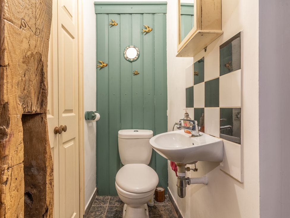 A bathroom with a toilet and sink at Hadley Park Windmill