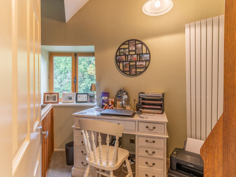 An office area with a desk and printer at Hadley Park Windmill in 