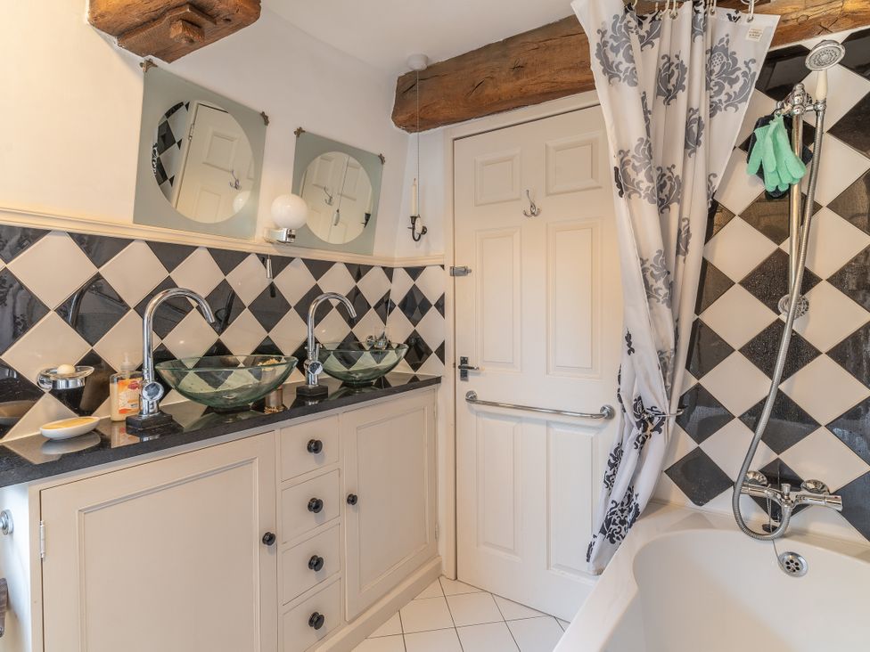 A bathroom with two sinks and a bathtub at Hadley Park Windmill 