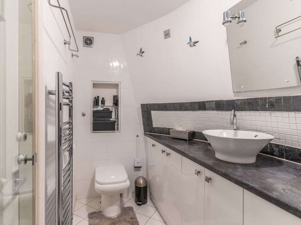 A bathroom with a toilet and sink at Hadley Park Windmill