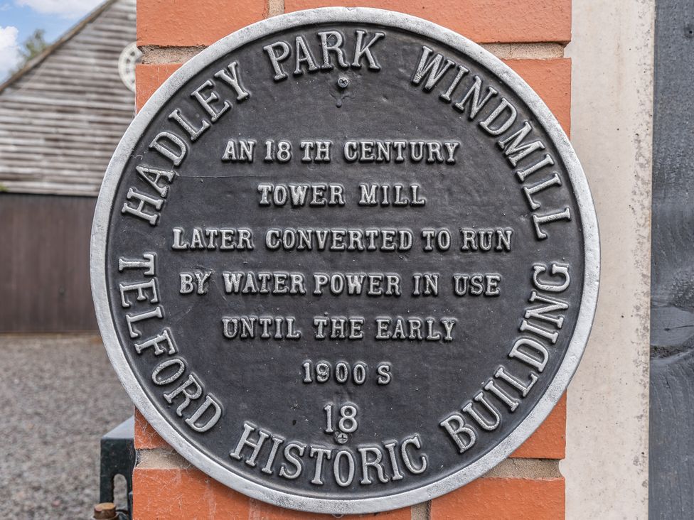 A plaque detailing the history of Hadley Park Windmill